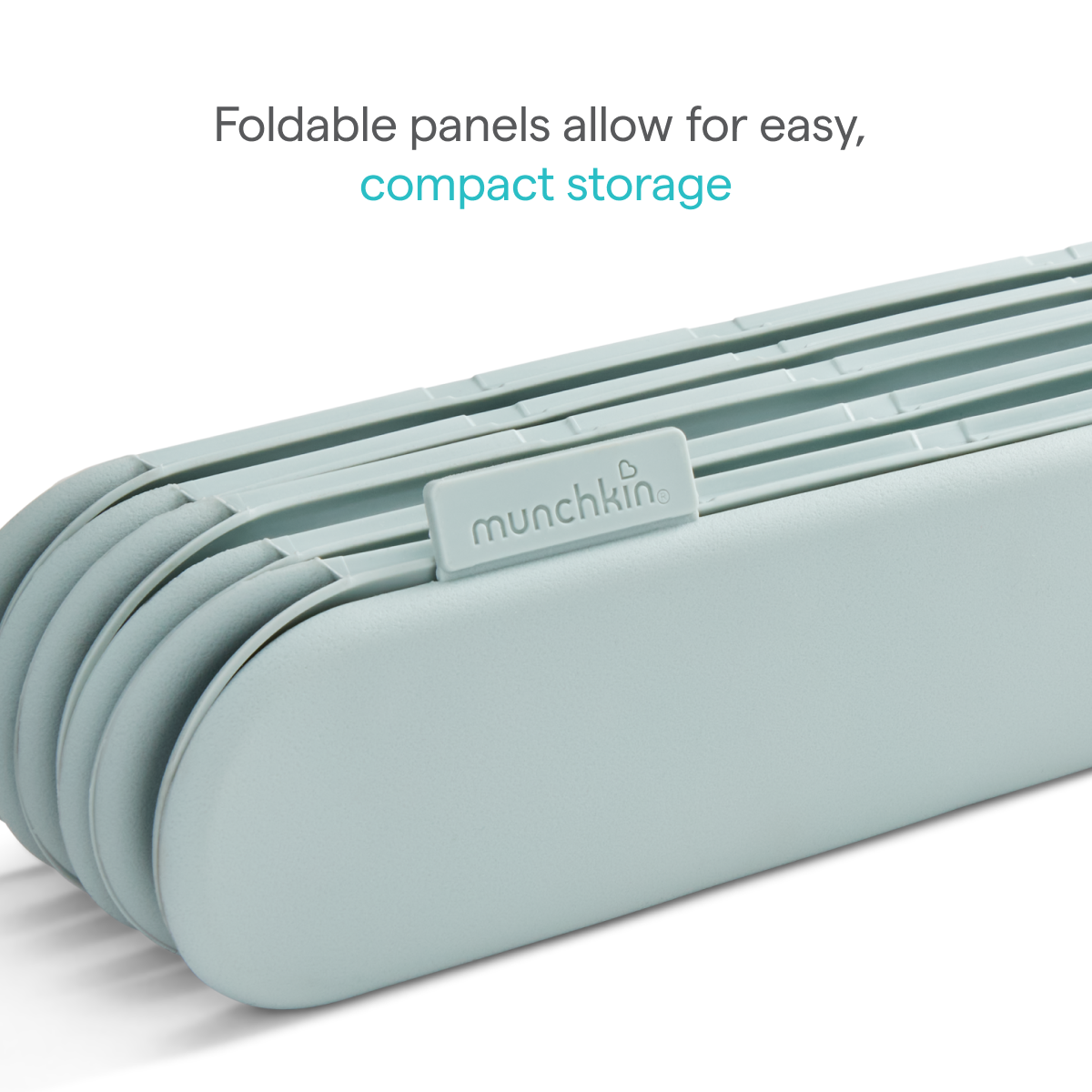 Sage green folded plastic play mat panels stacked flat, with text: Foldable panels allow for easy, compact storage