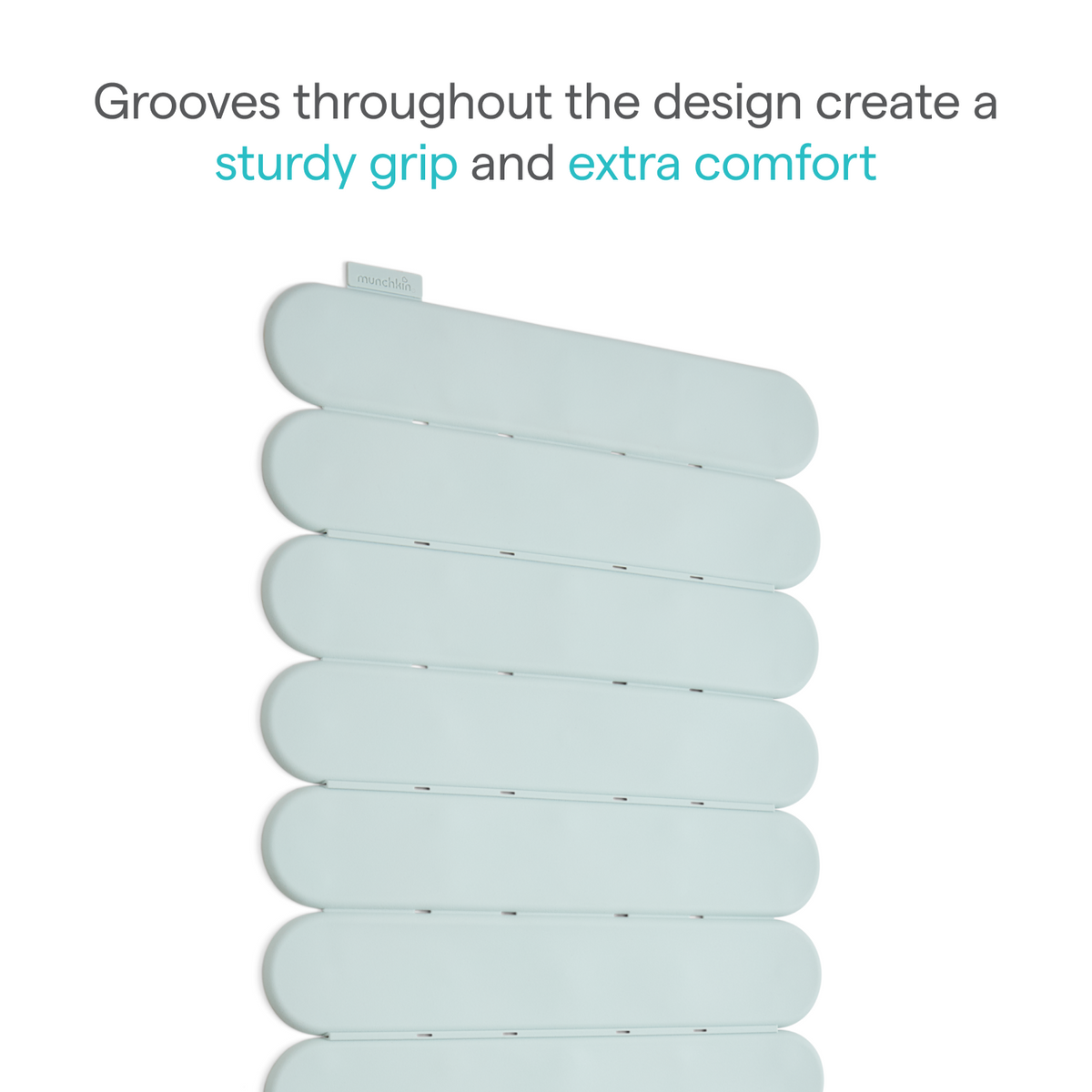 Close-up of mint green grooved bath mat panels with text about sturdy grip and extra comfort